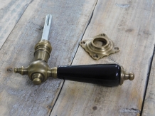 1 door handle brass with ceramic handle black and including mandrel.