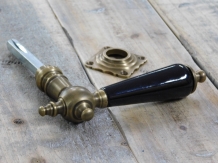 1 door handle brass with ceramic handle black and including mandrel.