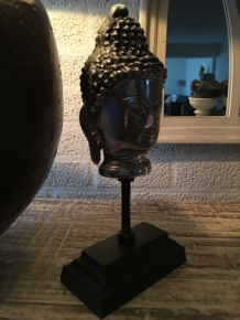 Buddha head on metal tripod, aluminum.