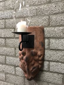 Wind light of roof tile with mythical image, with candlestick and glass flask.