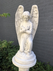 Angel - weatherproof, kneeling, on a pedestal, full of stone, large statue.