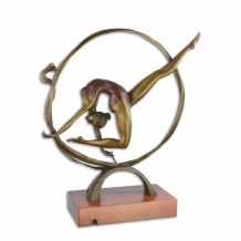 A bronze statue/sculpture of a contortionist, on a wooden base