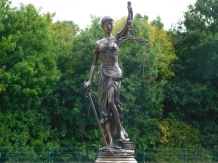 A large statue of Lady Justice, bronze-look, very beautiful!