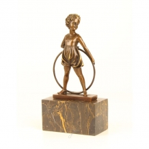 A bronze statue/sculpture of a hula hoop girl