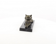 A bronze statue/sculpture of a lying cat, modernist style