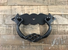 A door handle made of wrought iron, with beautifully turned handle, matt black