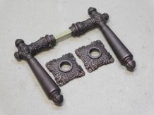 Set of door handles - including rosettes - iron - red/brown rusted