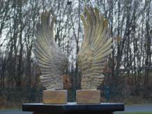 Set of two standing wings - polystone with wooden base