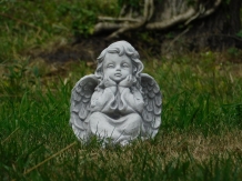 Angel sitting full of stone, beautiful in detail.