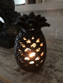 Cast iron lantern in the shape of a pineapple, atmospheric lighting.