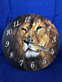 Wooden clock with image of a lion.