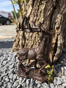 Beautiful cast iron deer on stand.