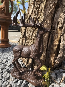 Beautiful cast iron deer on stand.