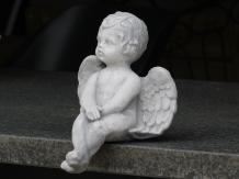 Angel - sitting - full made of stone