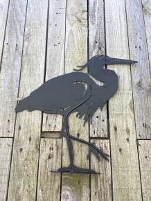 Prachtig silhouette van een reiger, mat zwart metaal