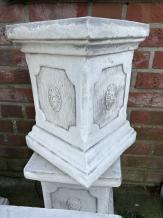 Pedestal pillar console made of solid cast stone.