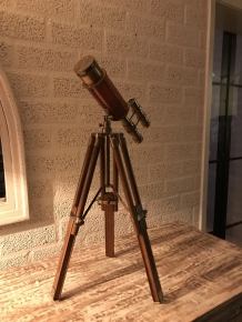 Beautiful decorative telescope on a wooden tripod