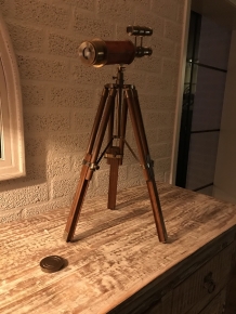 Beautiful decorative telescope on a wooden tripod