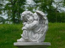 Sitting angel on pedestal - full stone