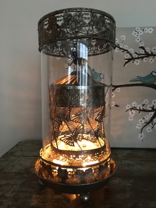 Beautiful metal lantern with separate rotating fire hood and cut glass.