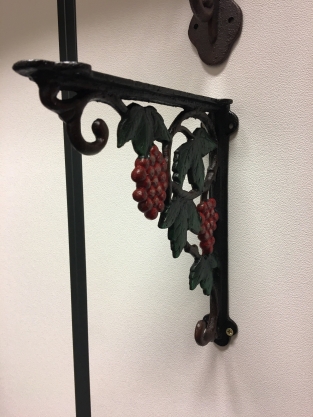 Beautiful shelf hanger with grape motif, cast iron-small