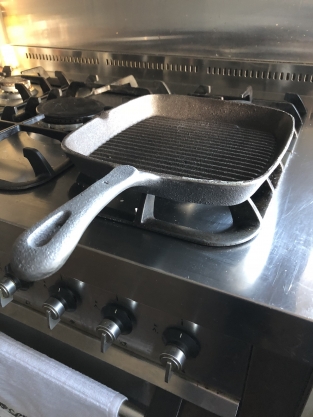 Heavy cast-iron grill pan, old-fashioned top quality.