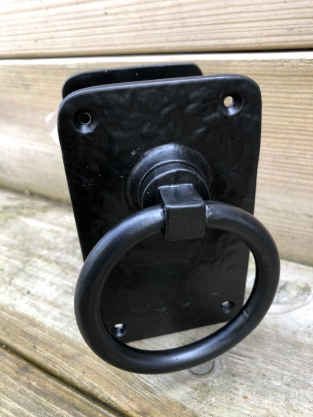 Pair off rustic large black rings as door closers/gate closers, beautifully nostalgic.