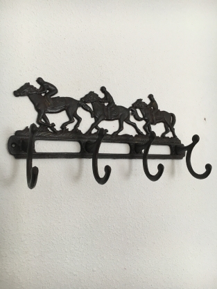 Coat rack with horses, 8 angles, cast iron