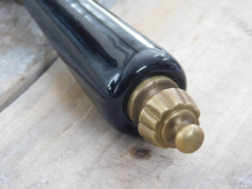 1 Door handle with ceramic handle black, brass patinated