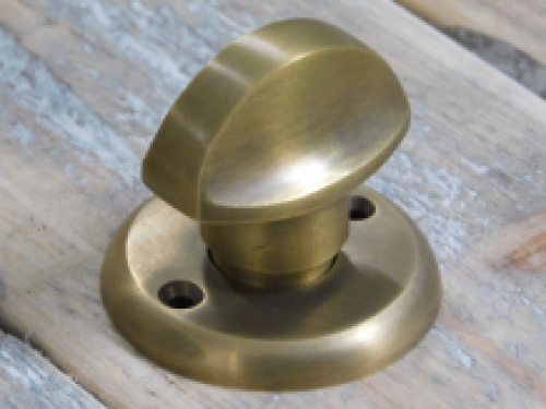 Toilet door hardware, twist lock, brass patinated