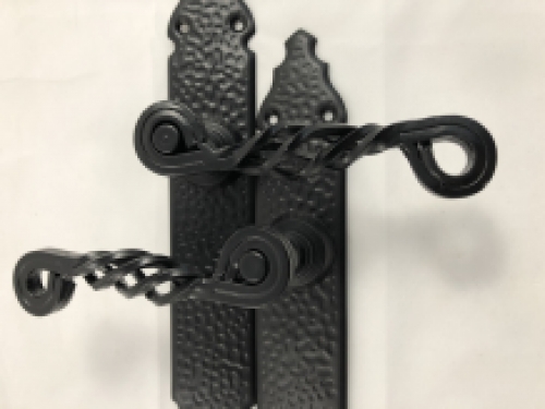 Set of front door hardware, beautiful wrought iron, black, closed door plate.