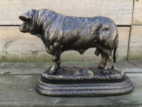 A beautiful statue of a bull, made of cast iron