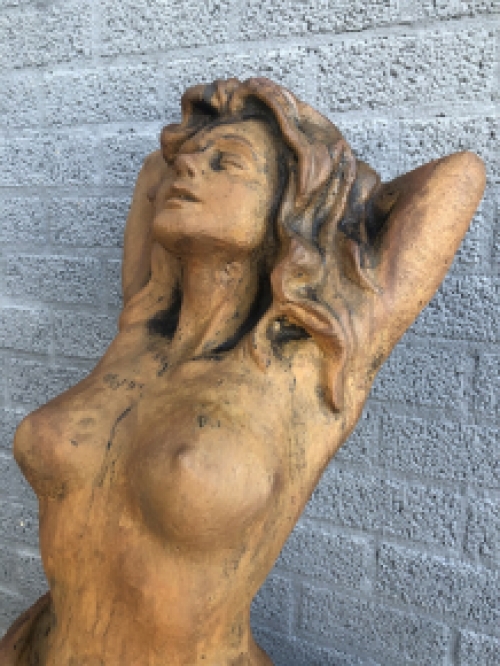 A beautiful statue of a naked woman, completely cast iron rust oxide, beautiful in detail!