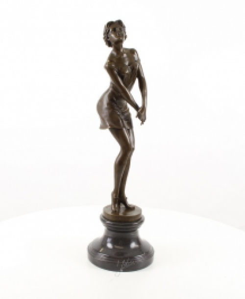 A bronze statue/sculpture of a pensive woman