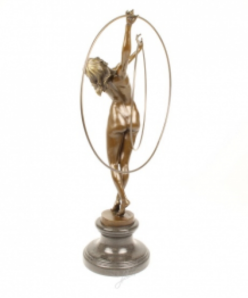 A bronze statue/sculpture of a naked hula hoop dancer