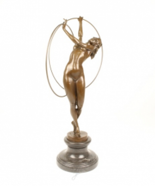 A bronze statue/sculpture of a naked hula hoop dancer