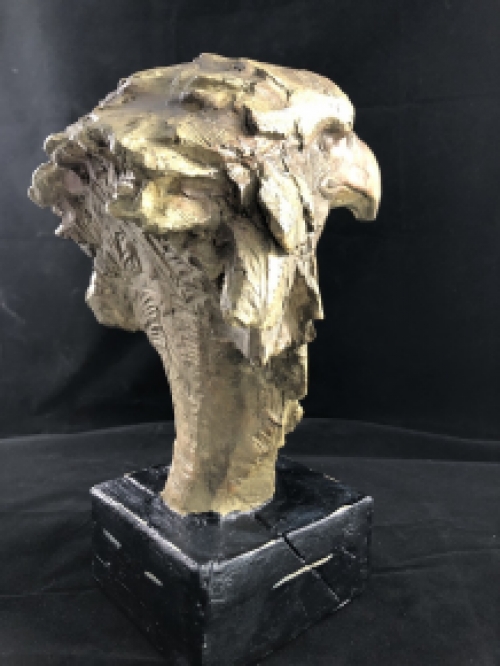 A beautiful head of an eagle, beautiful in detail, polystone wood look