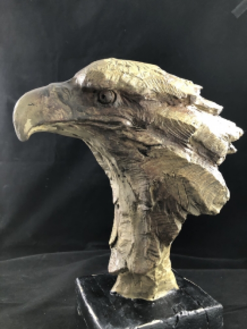 A beautiful head of an eagle, beautiful in detail, polystone wood look