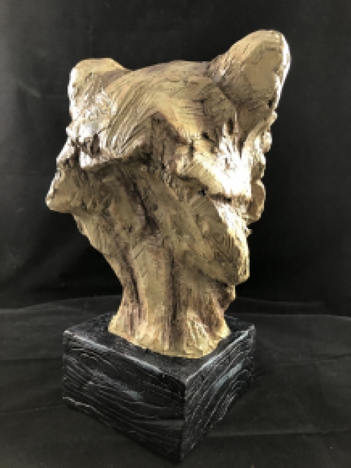 A beautiful head of a lion, beautiful in detail, polystone wood look