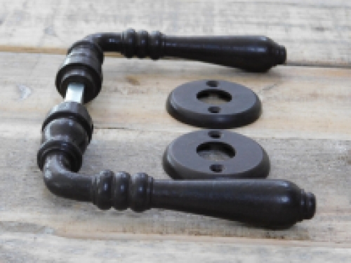 Door hardware set with 2 handles, 2 rosettes and a mandrel, dark brown