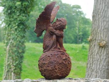 Angel on globe - cast iron