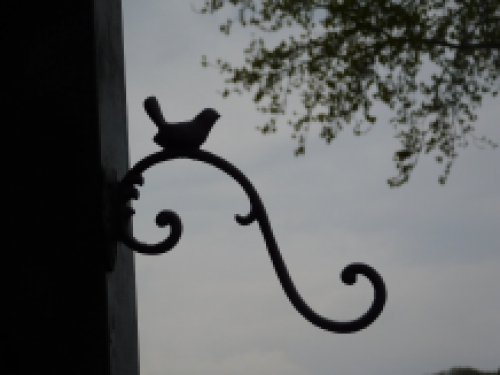 Cast iron hook with bird, brown, very beautiful to behold