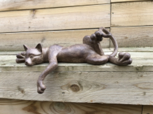 Sculpture lying cat from Polystein