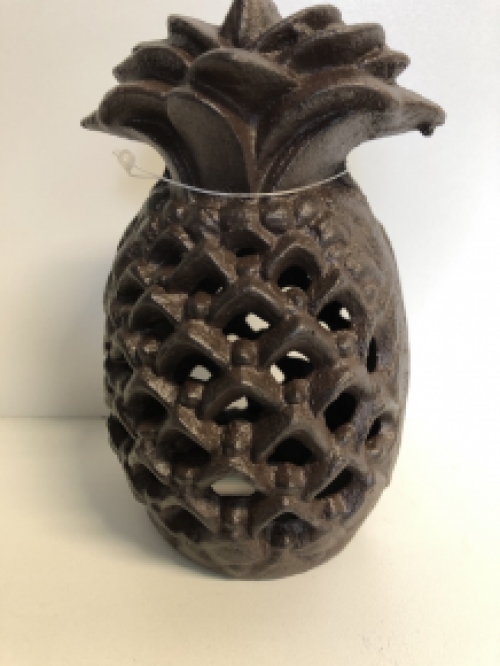 Cast iron lantern in the shape of a pineapple, atmospheric lighting.