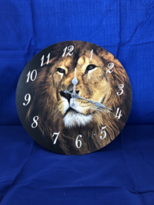 Wooden clock with image of a lion.