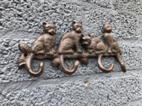 Coat rack with 4 cats and the hooks are the tails, great!