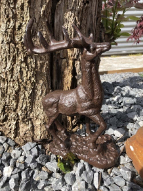 Beautiful cast iron deer on stand.