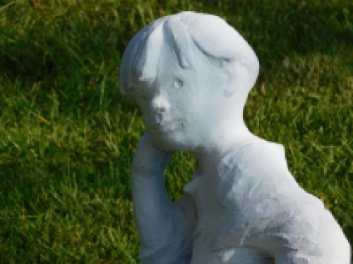 Statue sitting boy - solid stone