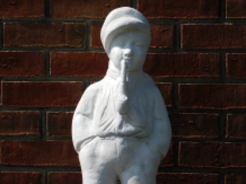 Statue boy with pipe - solid stone