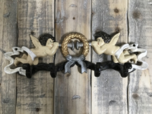 Coat rack with angel, in cast iron and in color